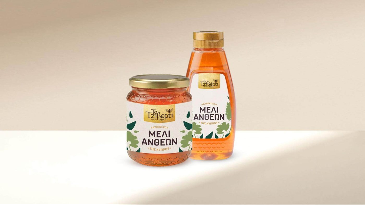 The redesigned jar and squeeze bottle side by side, carrying the new origin statement