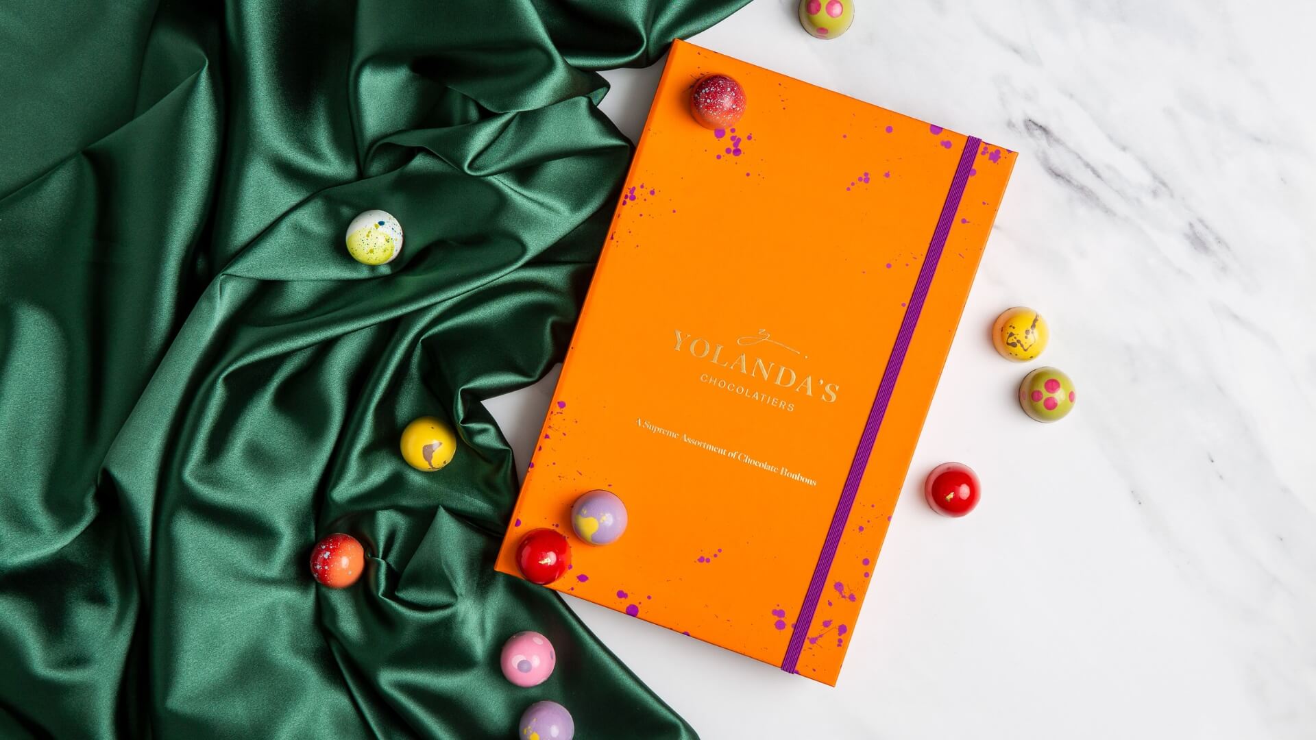 A Yolanda&rsquo;s box of bonbons on green silk, presented as a gift