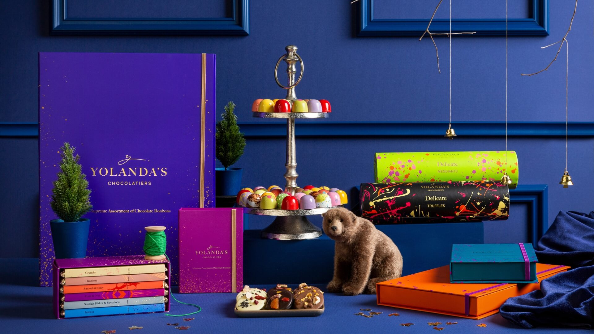 The Yolanda&rsquo;s range on a styled gift table: boxes, bars, truffles and a bear